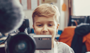 an image of a child recording a video