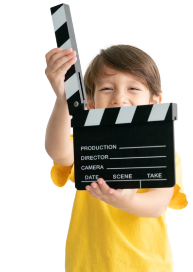 selectived-focus-film-making-clapper-board-holding-by-happy-boy (1)_clipped_rev_1 2