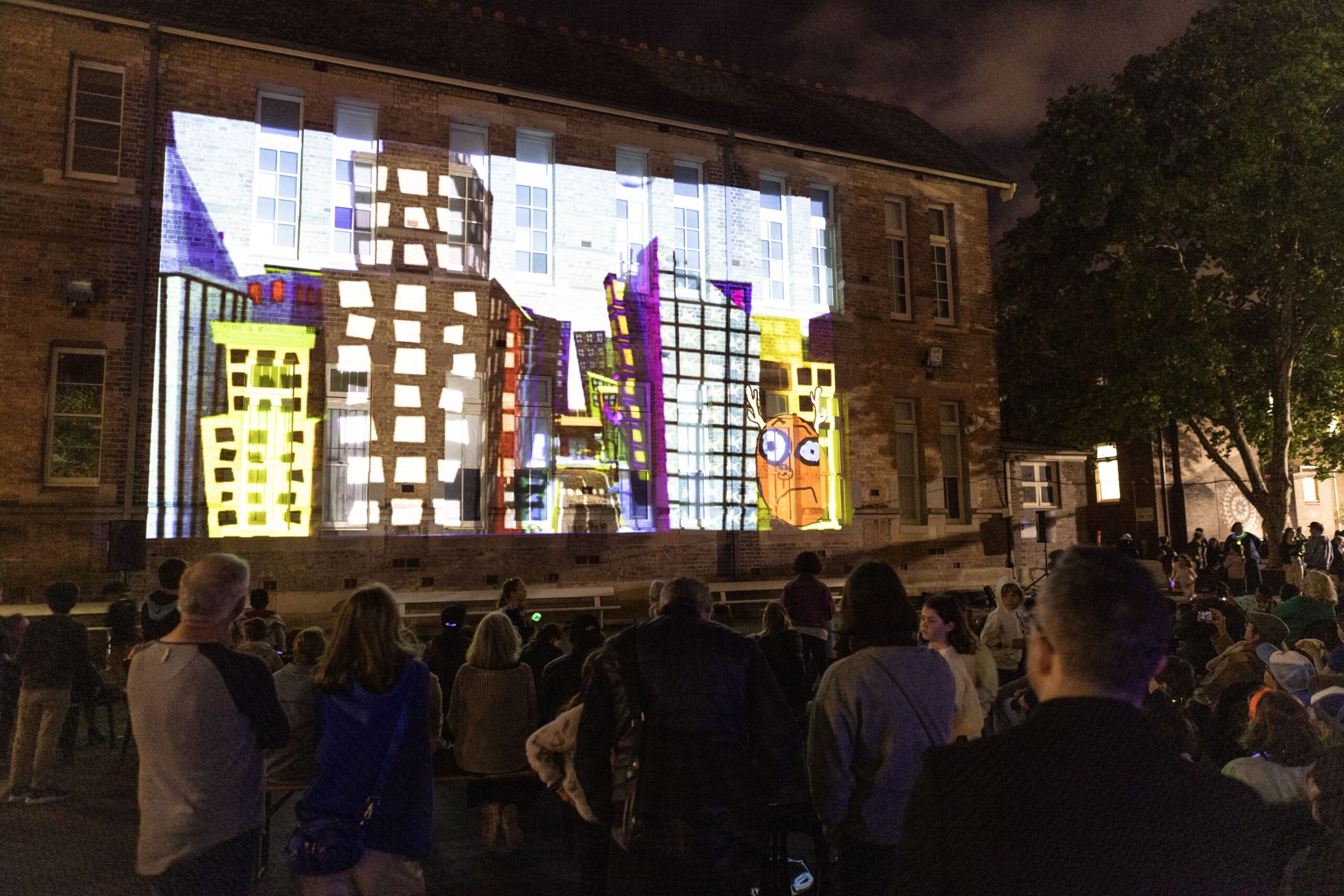 an image of a film screening on a building walls
